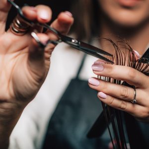 hair stylist cutting hair